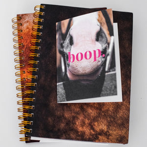 greeting card with a pony nose that says "boop" in hot pink letters
